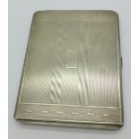 A silver Art Deco cigarette case with inscription inside dated 1943, 169.