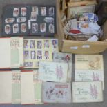 Thirteen albums and booklets of cigarette cards and loose cigarette cards