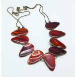 A base metal and red enamelled Arts and Crafts necklace