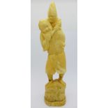 A carved ivory figure, a/f,