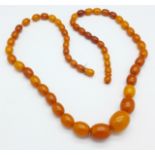 A set of butterscotch amber beads, 24.