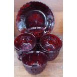 Six ruby glass cups and saucers and a sandwich plate