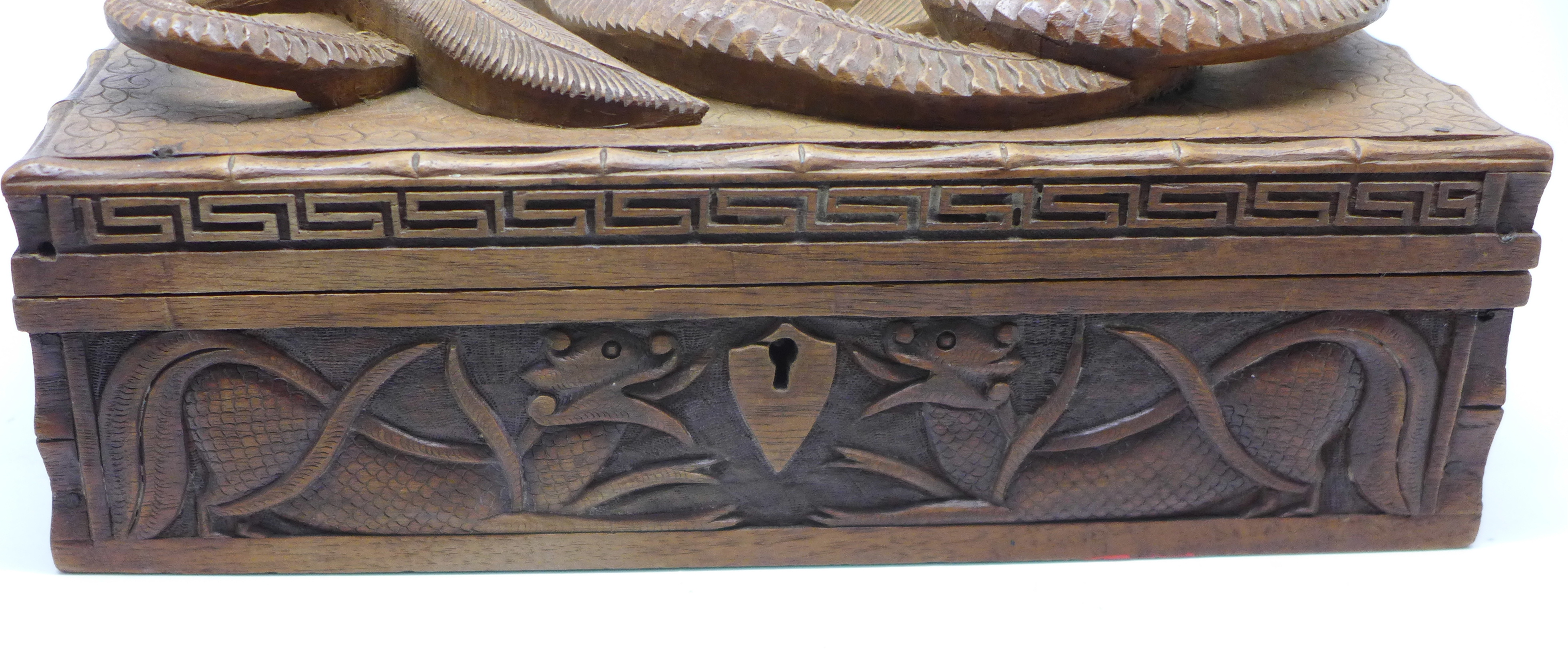 A Chinese carved wooden box with dragon top and carved side, - Image 3 of 4