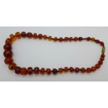 A string of faceted amber beads