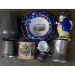 A box of pewter and china including a large Staffordshire cup and saucer
