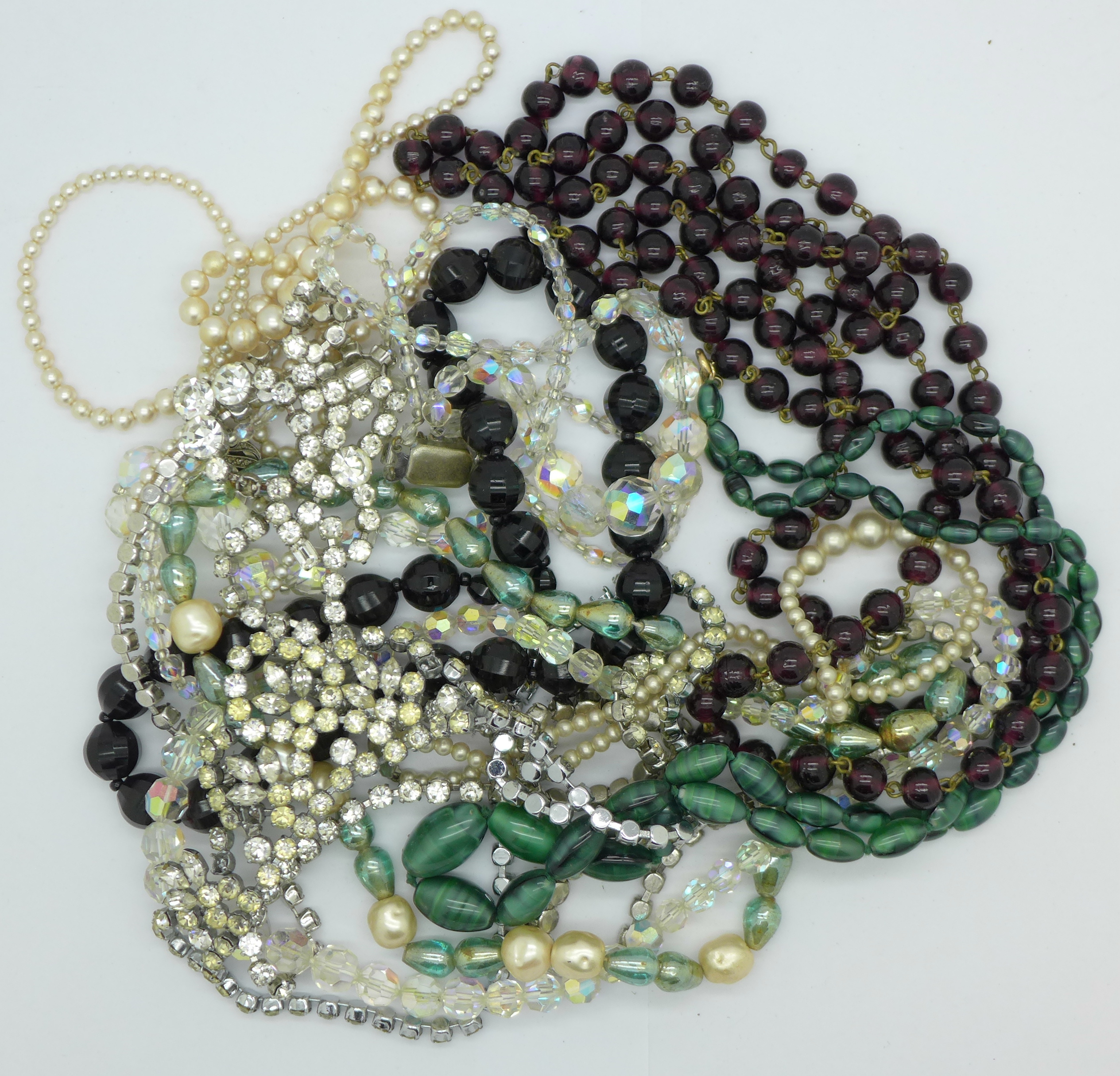 Necklaces including a faux pearl necklace with silver clasp