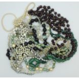 Necklaces including a faux pearl necklace with silver clasp