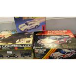 Three radio controlled model cars, Turbo King, Porsche 930 Turbo and Porsche 911 Turbo,