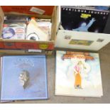 Fifteen LP records including Bad Company and Wings and a box of 7" vinyl singles,