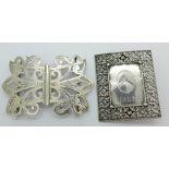 Two silver buckles,