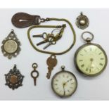 A silver pocket watch, a continental silver fob watch,