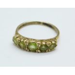 A 9ct gold and peridot ring, 1.