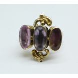 A 9ct gold, three stone amethyst ring, 5.