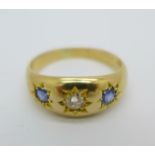 An 18ct gold, sapphire and diamond gypsy set three stone ring, 4g, L,