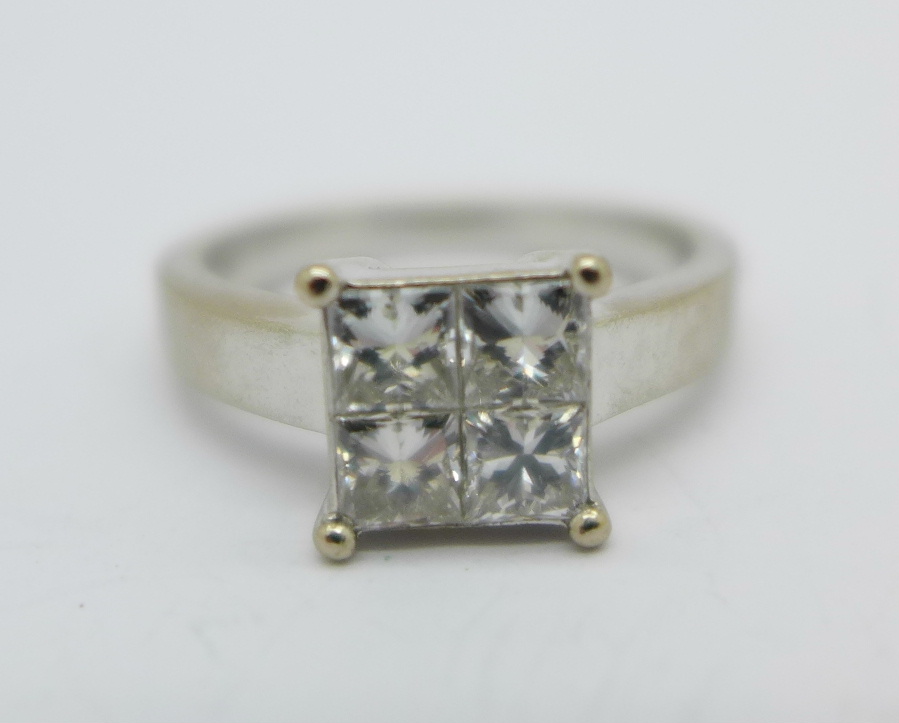 An 18ct white gold square ring set with four princess cut diamonds, approximate diamond weight 1.