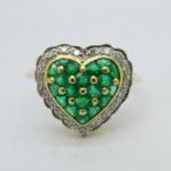 An 18ct gold, diamond and emerald heart shaped ring,