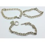 Three silver bracelets,