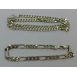 A silver neck chain and bracelet,