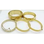Five rolled gold bangles