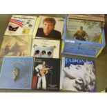 A collection of LP records including Madonna, Bon Jovi, Wings, Paul Simon, Muddy Waters,