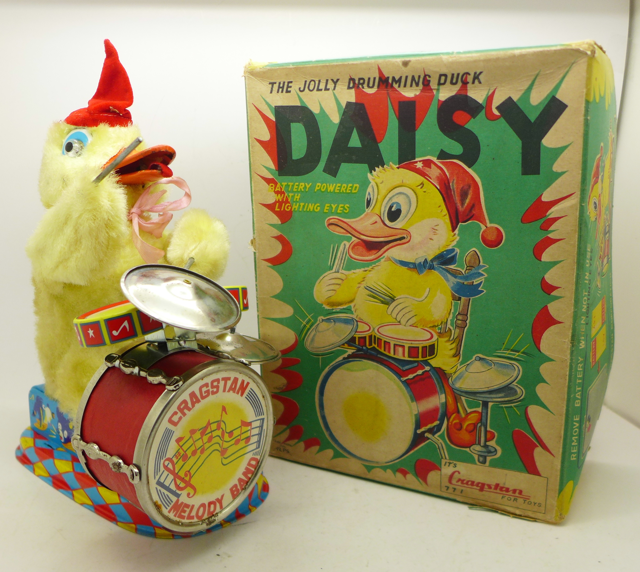 A Cragstan toy The Jolly Drumming Duck, Daisy, battery operated,