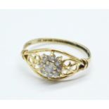 A 14k gold cluster ring, 1.