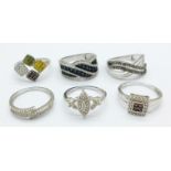 Six silver and stone set rings