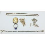 A silver bracelet, two silver chains, a .925 cameo brooch, a silver ring and a silver brooch, 44.