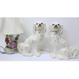 A pair of Staffordshire spaniels and a continental figural table lamp