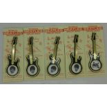 A set of five The Beatles guitar brooches