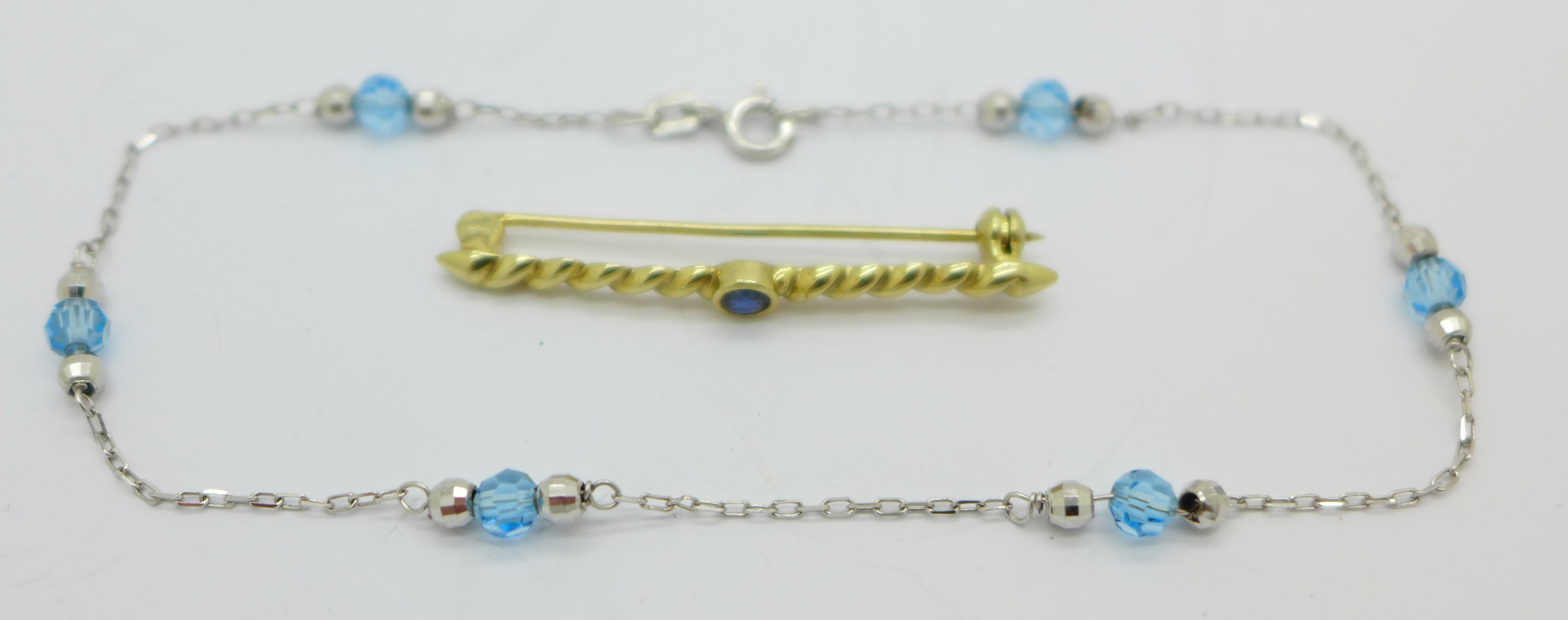 A 9ct white gold bracelet and a 9ct gold brooch, 3.