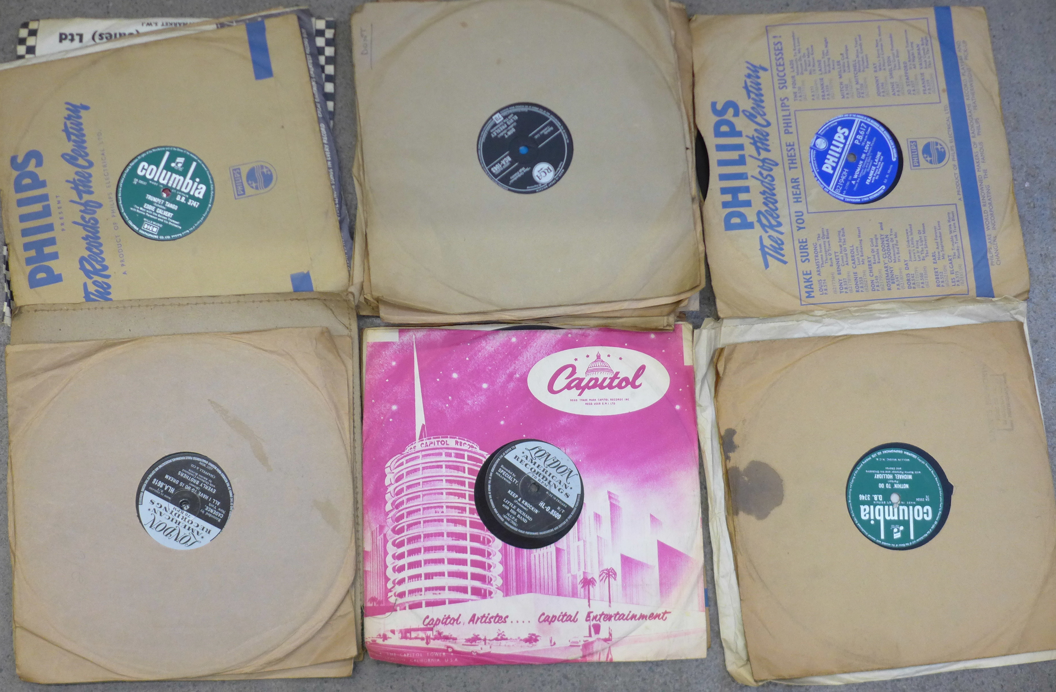 A collection of 78rpm records, rock 'n' roll, including Elvis Presley, Jerry Lee Lewis,