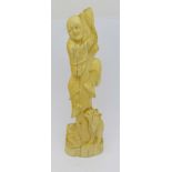 A carved ivory figure, a/f, 15.