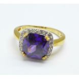 A silver gilt amethyst and cubic zirconia ring,
