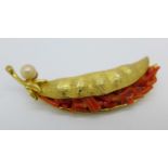 A vintage designer brooch with coral and cultured pearl signed "Capri"