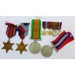 A set of four WWII medals and miniatures