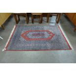A red ground prayer rug,