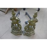 A pair of 19th Century brass and iron andirons