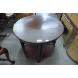 A mahogany circular nest of tables