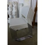 A set of six Daylight chrome and mesh stacking chairs