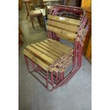 A set of six tubular steel stacking chairs