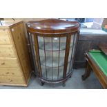 A mahogany demi-lune display cabinet