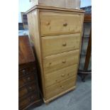 A pine chest of drawers