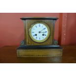 A Victorian inlaid walnut and ebonised mantel clock