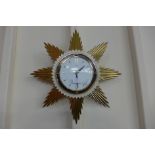 A Metamec sunburst wall clock