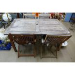 A teak garden table and four chairs