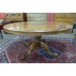 A Victorian burr walnut oval tilt top breakfast table
