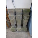A set of three stone balustrades
