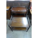 Two mahogany two tier trolleys