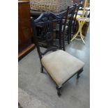 A Victorian ebonised nursing chair